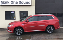 Red 2018 Mitsubishi Outlander Hybrid with premium window tint